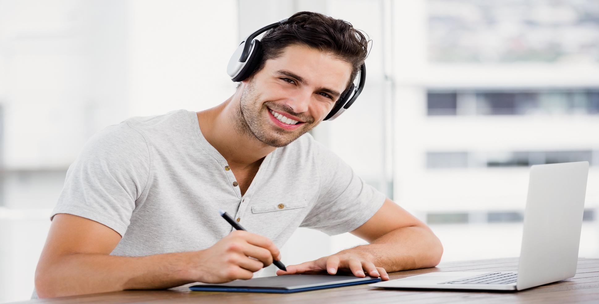 Man wearing headphones researching about Savings and Deposits